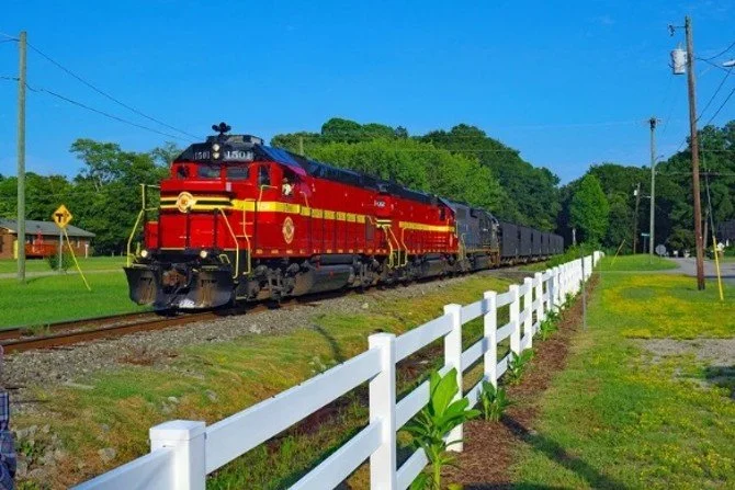 Carolina Coastal Railway's heritage units lead train No.114 south on the original Norfolk Southern Railway main line toward Charlotte.