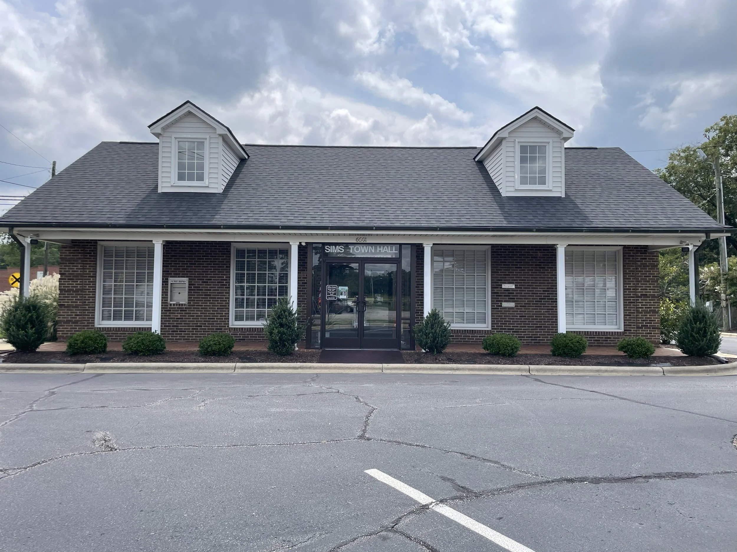 Photo of the front of Sims Town Hall